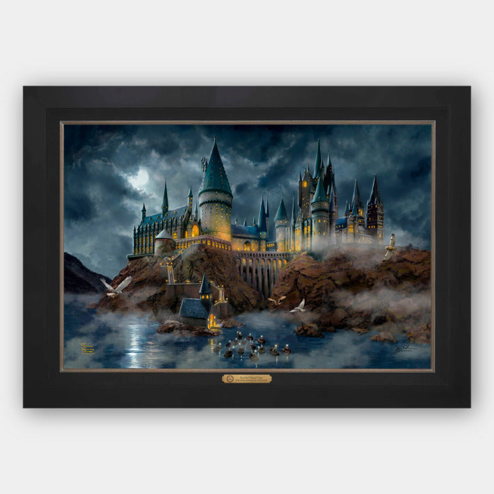 Harry Potter Hogwarts Castle in a dark brown frame featuring the Hogwarts Castle at night with boats crossing the lake.