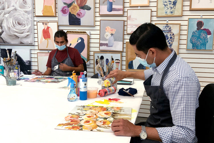 Artist hand-painting collectible art in Art Brand Studios studio – Disney and Star Wars licensed artwork for wholesale retailers.